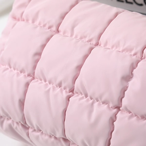 Portable pink quilted makeup bag with elegant diamond stitching and high capacity travel design