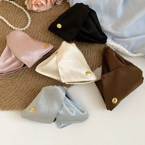 Detail of satin fabric triangle hair claws in five colors with pearls and roses