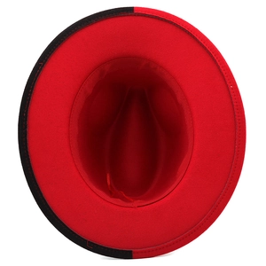 Overhead view of a two-tone red and black felt fedora hat with a flat brim and inner structure