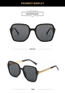 Detail of stylish oversized polygon sunglasses featuring unique golden chain link temples