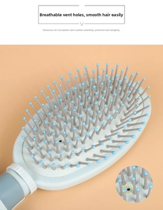 Detail of air-cushion hairbrush showing a vent hole for scalp pressure relief