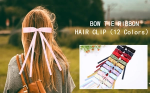 Detailed view of elegant satin bow hair clips available in 12 assorted vibrant colors