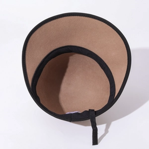 Detail of wool felt equestrian cap interior with black sweatband and authentic wash label