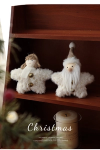 Detail of plush Christmas star doll hanging ornaments with gold polka dots and bells