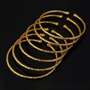Set of six gold plated 3mm twist rope bangles with bead ends for women's bridal jewelry
