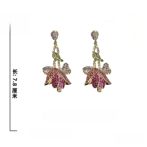 Detailed close-up of vintage tulip earrings with 925 silver needles and colorful rhinestones
