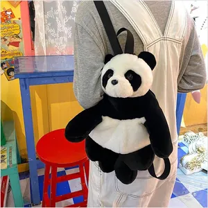 Detail of plush panda backpack showing soft faux fur texture and black shoulder straps