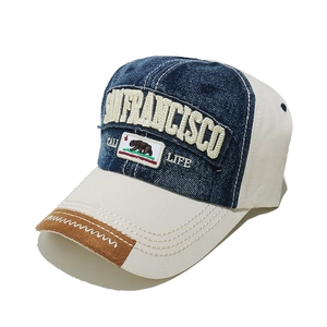 Close-up of vintage San Francisco embroidery and California bear patch on baseball cap