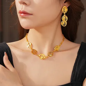 Vintage style gold floral jewelry set with hollow spiral necklace and drop earrings