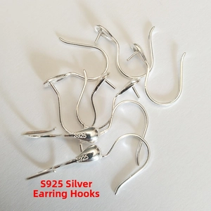 Macro shot of S925 sterling silver earring hooks with official S925 hallmark stamps