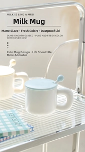 Detail of matte ceramic mug featuring round thick handle and ball-shaped stir spoon