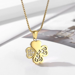 Elegant gold hollowed four-leaf clover pendant necklace with sparkling cubic zirconia inlay
