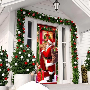 Christmas door banner with Santa and gift prints on a white house porch entrance