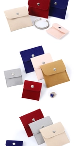 Detail shot of multi-color velvet jewelry pouches with snap buttons in soft fabric