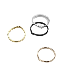 Polished V-shaped titanium steel rings in gold, silver, black, and rose gold finishes