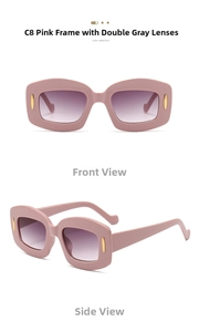 Close-up of retro pink rectangle sunglasses with gradient gray lenses and gold accents