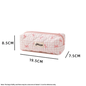 Detailed size view of pink checkered quilted pencil case with bow patterns and zipper