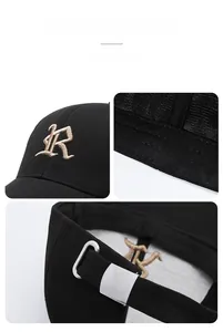 Detail view of black baseball cap with golden R embroidery and metal buckle strap