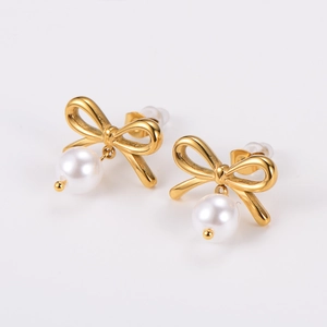 Elegant gold bow earrings with white pearl pendants set on a clean white background
