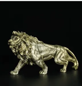Detailed close-up of golden lion resin statue showing muscular texture and mane detail