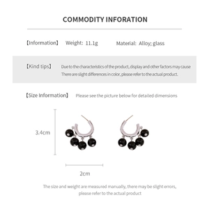 Detailed view of silver hoop earrings with black glass beads and precise dimensions
