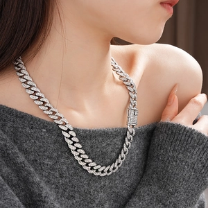 Silver punk Cuban chain necklace with sparkling rhinestones on a female model