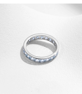 Detailed macro view of S925 sterling silver ring with light blue square-cut gemstones