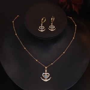 Golden necklace and earring set with heart-shaped anchor and blue zircon stones