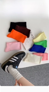 Detail of ribbed texture and elastic knit on multi-colored cotton crew socks