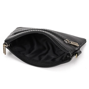 Detail view of the black leather wallet interior featuring multiple zipper compartments