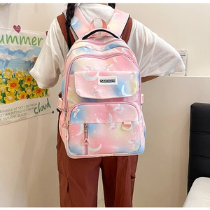 Rear view of a pink and blue gradient backpack with moon and butterfly prints