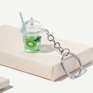 Luminous kiwi fruit milk tea cup keychain with resin ice cubes and striped straw