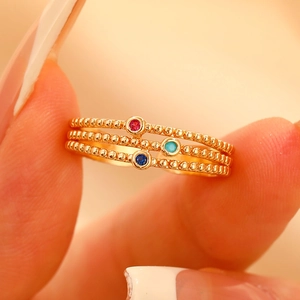Three-layer gold beaded ring set with colorful red green and blue zircon gemstones