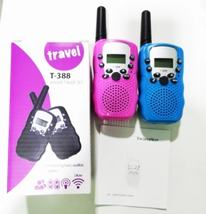 Kids T-388 walkie talkie set in pink and blue with colorful packaging and manual