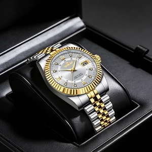 Detailed close-up of two-tone steel watch dial with Roman numerals and date calendar window