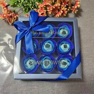Close-up of blue rose soap flower gift box with 9 gradient roses and a satin ribbon