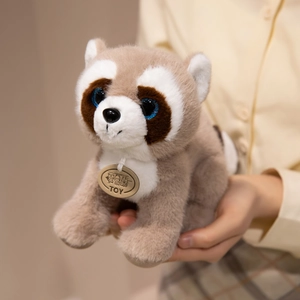Plush raccoon toy with grey long fur, sparkling blue eyes and golden neck tag pendant