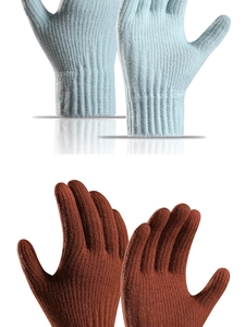 Detailed knit texture of warm winter gloves in sky blue and reddish brown colors
