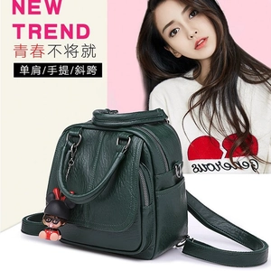 Versatile dark green faux leather women's backpack and shoulder bag with cartoon charm