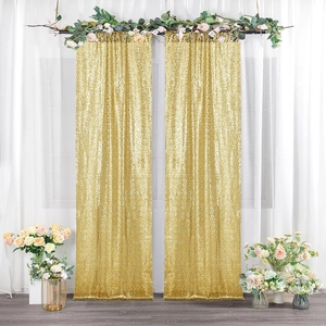 Detail of shimmering gold sequin fabric backdrop curtains for wedding and event decor
