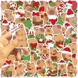 Close-up of cute Christmas Capybara stickers with festive hats and holiday gift motifs