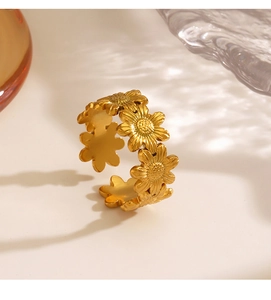 Macro shot of gold sunflower open ring with detailed petals and polished finish