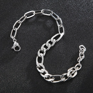Close-up of silver stainless steel mixed chain bracelet with lobster clasp on black background