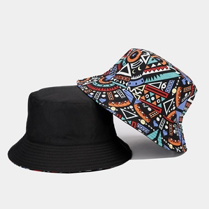 Two reversible bucket hats featuring solid black and colorful bohemian geometric patterns