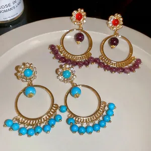 Ethnic bohemian round hoop earrings with sparkling diamonds and colorful beads in gold finish