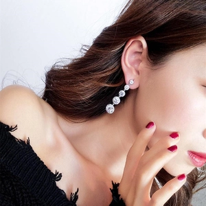 Long tassel drop earrings with sparkling cubic zirconia crystals in silver finish