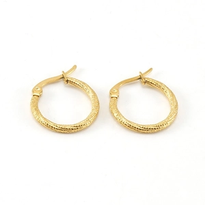 Polished gold circular hoop earrings with twisted spiral texture on white background