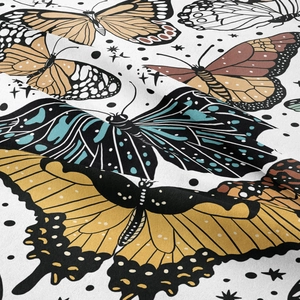Macro detail of bohemian butterfly tapestry fabric showing soft texture and digital print