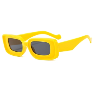 Retro yellow rectangular sunglasses with thick plastic frames and dark grey lenses for women