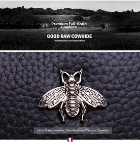 Detail of lychee pattern leather wallet with metal bee emblem and French flag tag